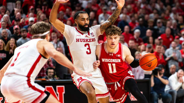 Feb 1, 2024; Lincoln, Nebraska, USA; Wisconsin Badgers guard Max Klesmit (11) drives against Nebraska Cornhuskers guard Brice Williams (3) during the second half at Pinnacle Bank Arena.